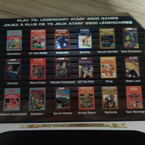 Atari Pocket Player Pro handheld console with games and box
