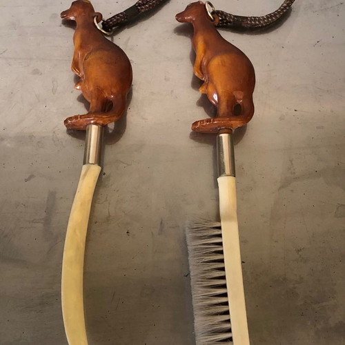 Shoe brush and shoehorn set used with kangaroo sculpture