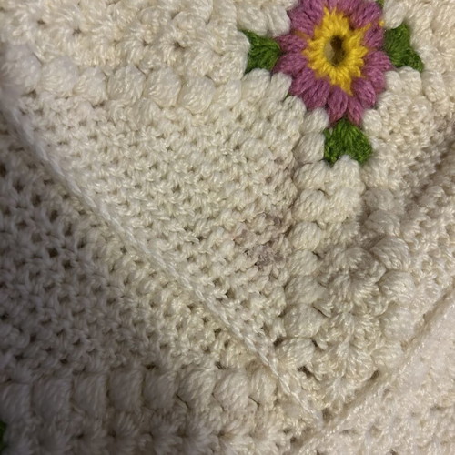 Handmade blanket used with floral crochet design