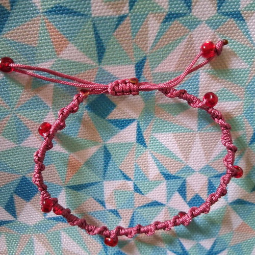 Macrame bracelet with decorative red beads, like new