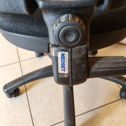 Office armchair with adjustable height and backrest