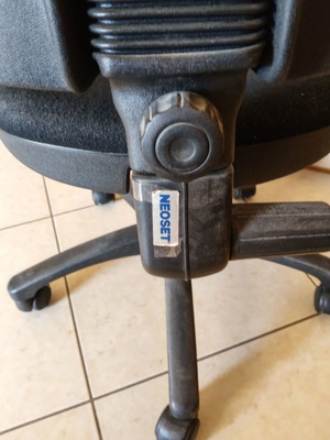 Office armchair with adjustable height and backrest