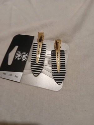 Hair clips new, black and white with gold metal details