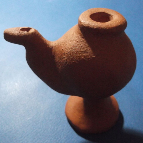 Clay oil lamp or water whistle with fleur-de-lis scouting emblem, used