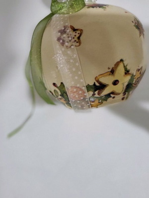 Christmas pomegranate new decorated with ribbons and decoupage