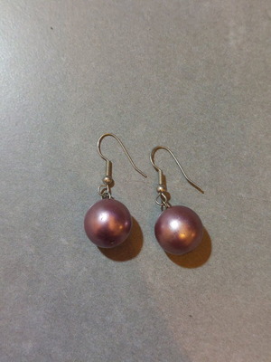 Dangling earrings used with purple and silver beads
