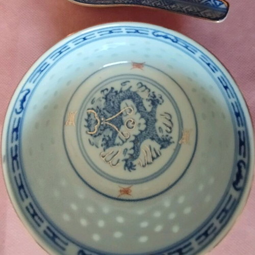 Chinese porcelain bowl with spoon and gilded rim like new