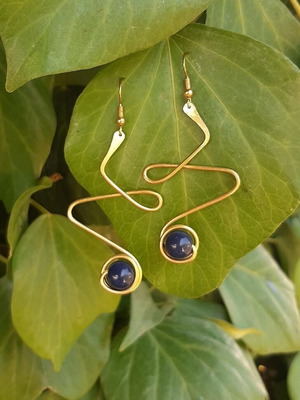 Handmade dangling earrings in gold tone with blue bead new