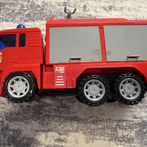 Fire truck toy used with sound, light, and water pump