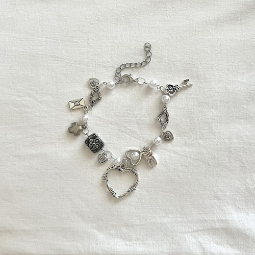 Vintage Charm Bracelet handmade with pearls and silver charms