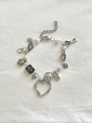 Vintage Charm Bracelet handmade with pearls and silver charms