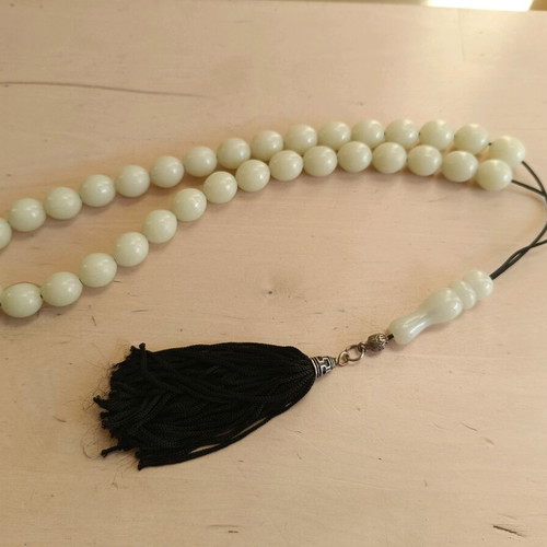 Plastic worry beads used that glow in the dark