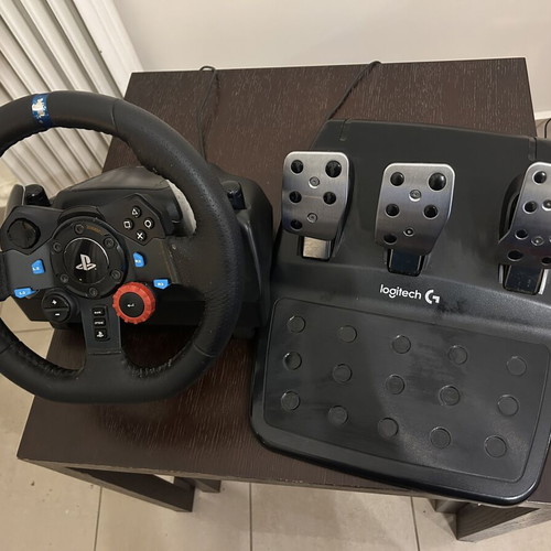 Logitech G29 steering wheel with PlayStation 4 Slim console, 2 controllers, 4 games used