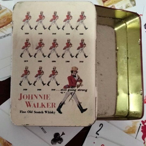 Johnnie Walker collectible playing cards laminated in metal box like new
