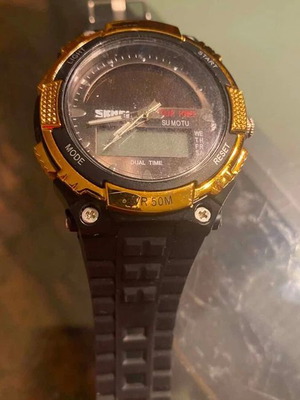 Skmei 1049 Solar Power sports digital watch used with gold bezel and black strap