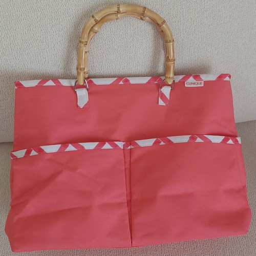 Clinique Limited Edition handbag, coral pink with white geometric pattern and bamboo handles