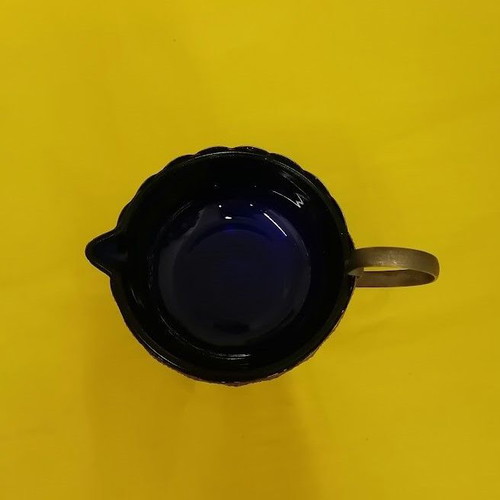 Vintage cobalt blue glass creamer with metal holder, like new