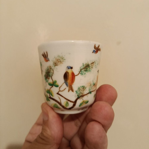 Vintage porcelain cup with bird design