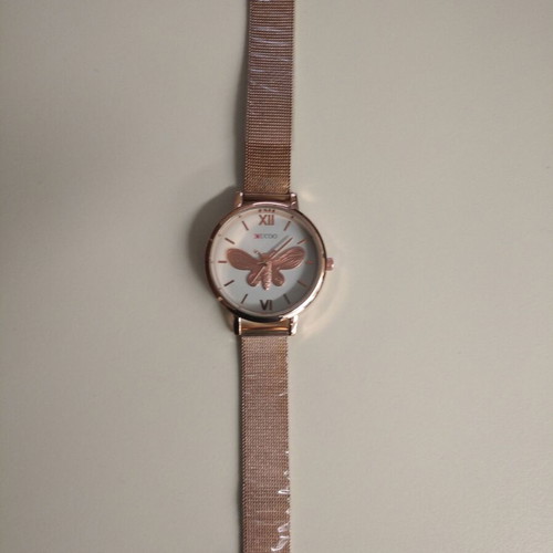 Women's watch new with embossed gold butterfly, pink-gold color