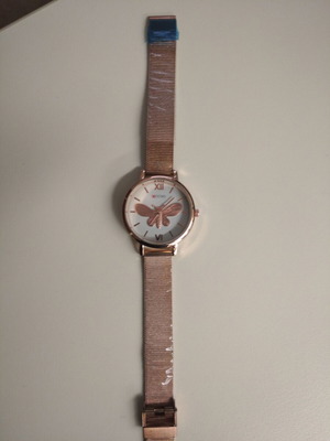 Women's watch new with embossed gold butterfly, pink-gold color