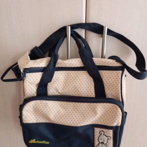 Baby equipment bag like new, beige with blue polka dots