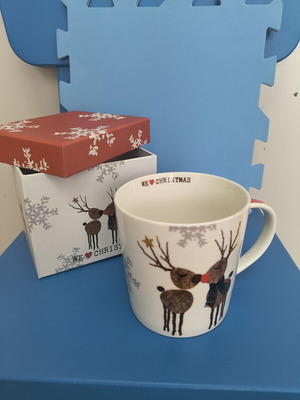 Christmas-themed mug with two reindeer
