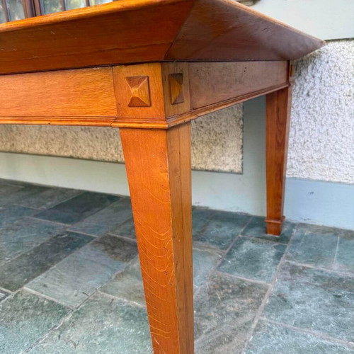 Solid wood dining table with decorative border and square legs