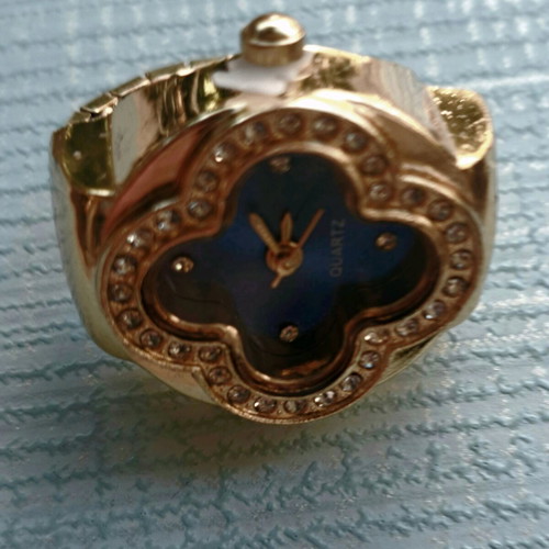 Four-leaf ring like new with quartz watch, blue dial and crystals