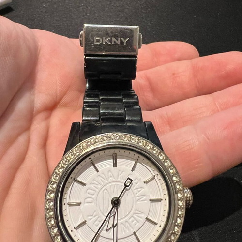 DKNY women's watch used with stones and black bracelet