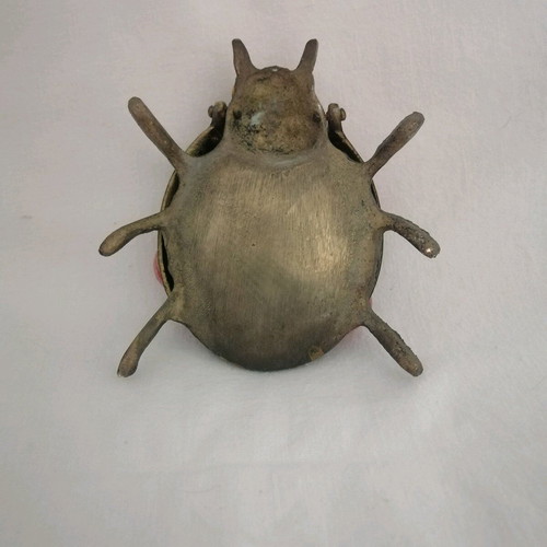Bronze ashtray used with red scarab-shaped stones