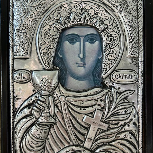 Religious icon used with metal overlay on wooden base