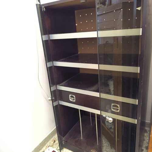 Vintage wooden cabinet with silver details, shelves and glass doors