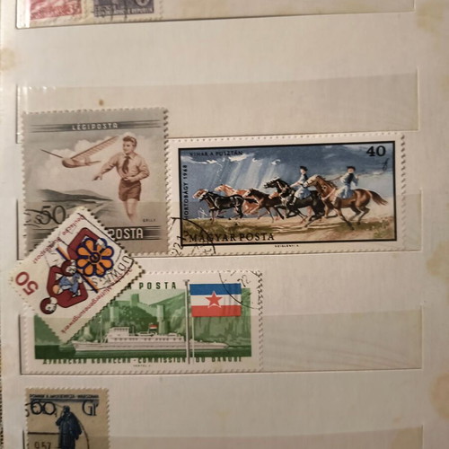 Stamp album like new with about 500 mostly foreign stamps