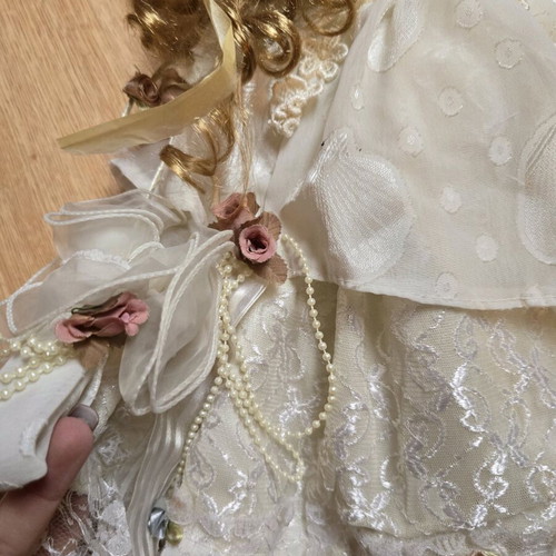 Glass Bride Doll like new with lace dress and hat