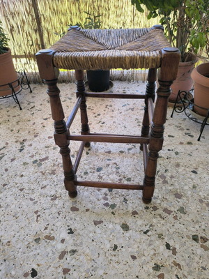 Vintage wicker stool used with wooden frame