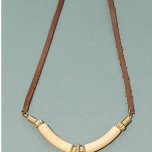 Ethnic necklace with brown leather cord and elephant pendant, vintage bakelite