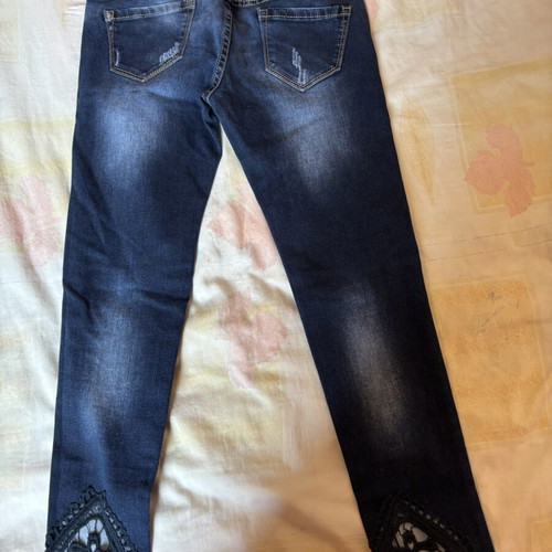 Dark blue skinny jeans with black lace and distressed details, size S, like new