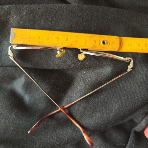Vogue eyeglass frame used, gold color