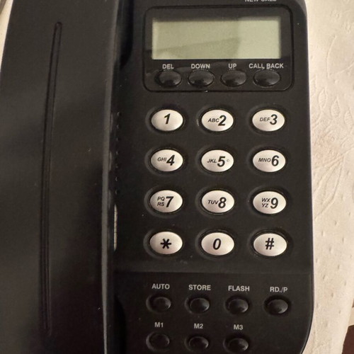 Telephone device like new, black wired