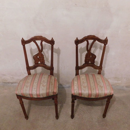 Pair of carved wooden chairs with striped fabric seat like new