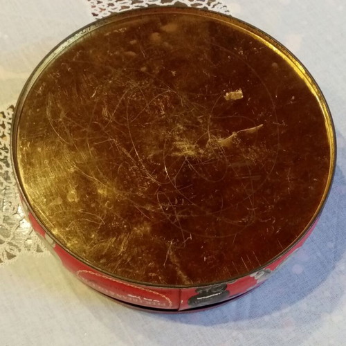 Vintage tin box used with floral and dog motifs
