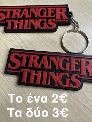 Stranger Things keychain like new, black and red