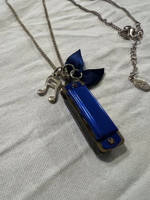 Necklace with hanging small harmonica Accessorize used, blue and silver