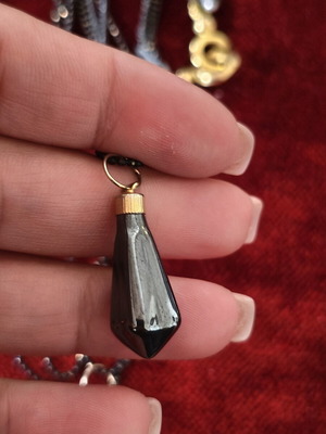Long necklace used with black beads and hematite pendants