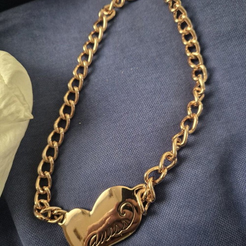 Guess steel necklace used, pink gold heart shape