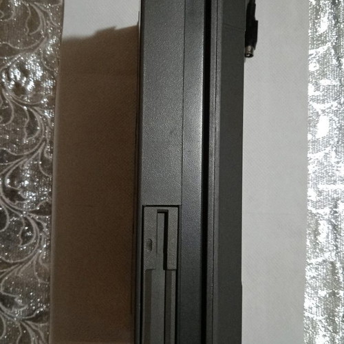 Texas Instruments vintage laptop used, 1980s with charger and mouse