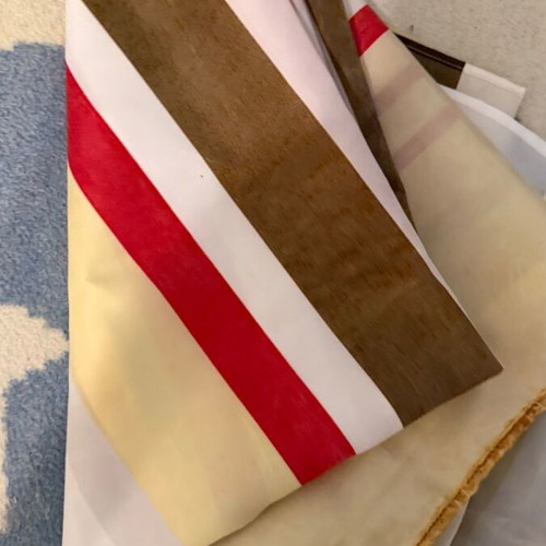 Fabric shower curtain with stripes used, metal grommets