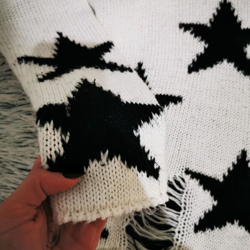 White sweater with black stars like new
