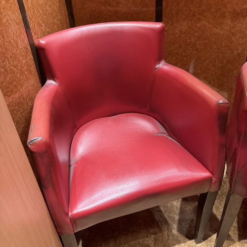 Red armchair with armrests, modern design