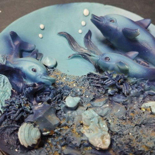 Decorative plate used with dolphins